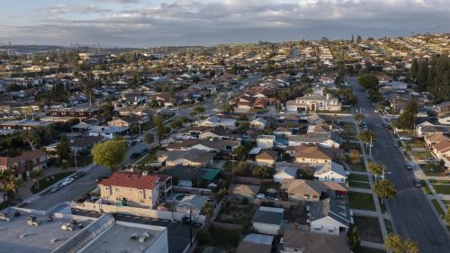 Sunset aerial view of dense suburban housing in Montebello, California, USA.