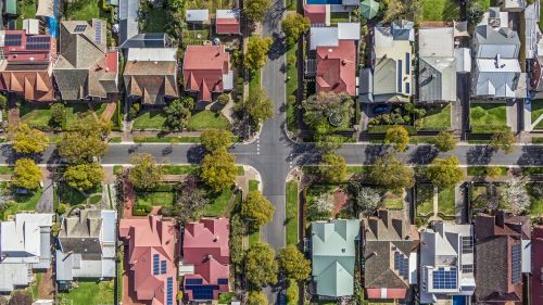 Aerial view of leafy eastern suburban houses on 4-way cross road intersection in Adelaide, South Australia