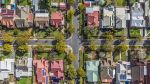 Aerial view of leafy eastern suburban houses on 4-way cross road intersection in Adelaide, South Australia